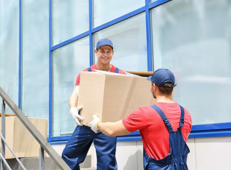Professional movers handling furniture in Belgravia